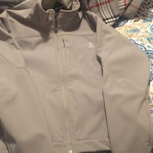gray north face jacket fleeced lining